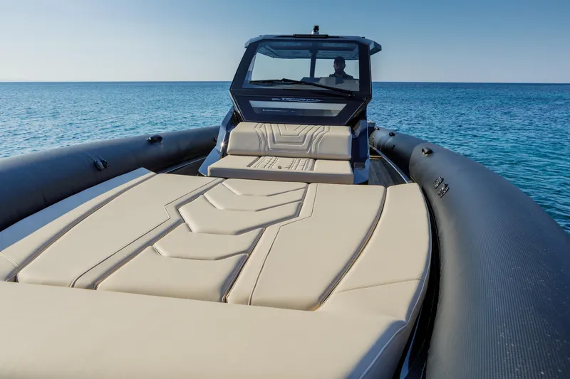 Slide: The Image of 2025 Technohull Alpha 40 luxury boat on calm sea, featuring sleek design and spacious seating. - 17