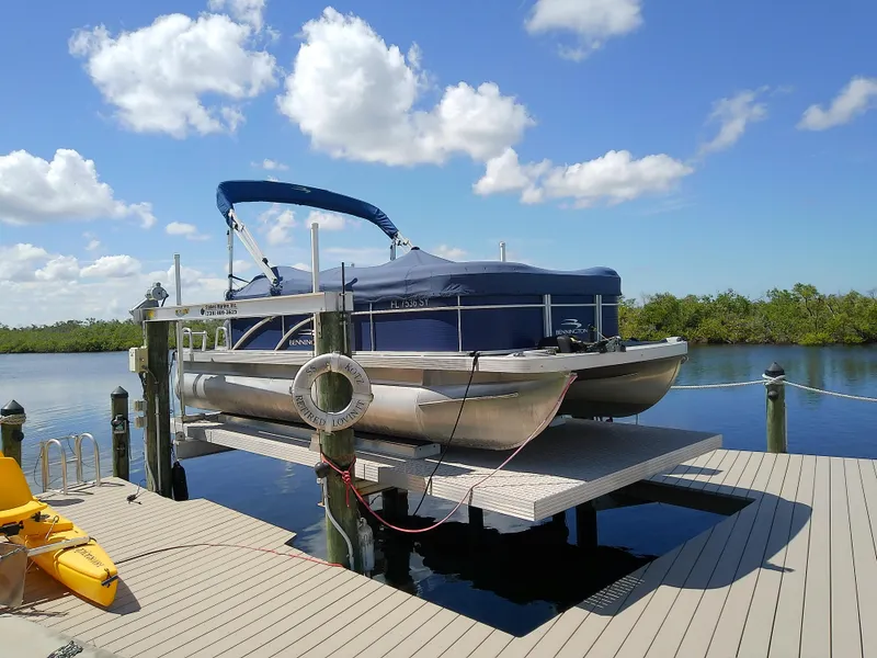 Slide: The Image of 2020 Bennington SV 20 SLV pontoon boat docked on a sunny day. - 1