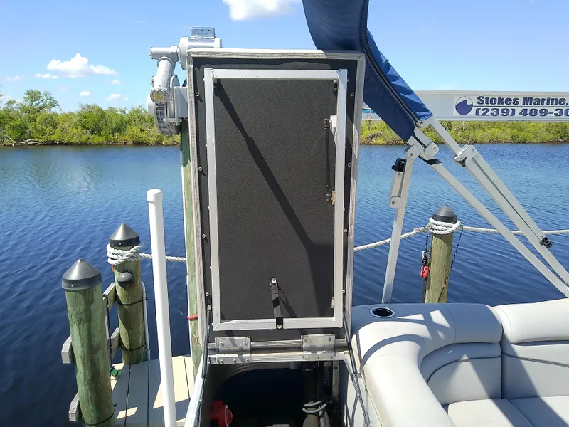 Slide: The Image of 2020 Bennington SV 20 SLV pontoon boat docked by a serene lake. - 28