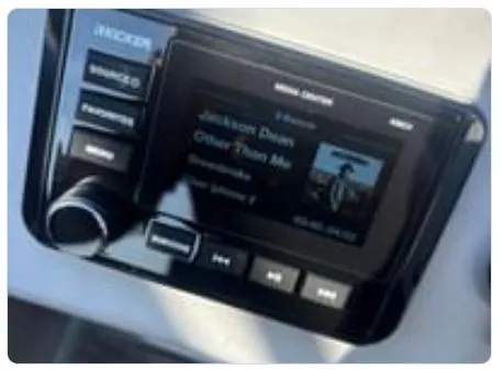 Slide: The Image of Close-up of a 2020 Bennington SV 20 SLV boat stereo system displaying music track. - 34