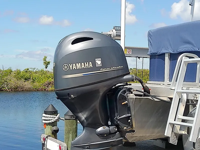 Slide: The Image of 2020 Bennington SV 20 SLV with Yamaha outboard motor by the water. - 8