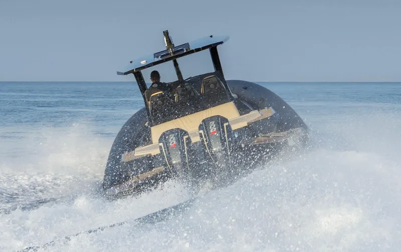 Slide: The Image of Technohull Alpha 40 (2025) speeding on water, showcasing powerful dual engines. - 10