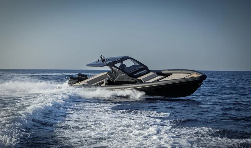 Slide: The Image of 2025 Technohull Alpha 40 speedboat cruising on open water. - 14