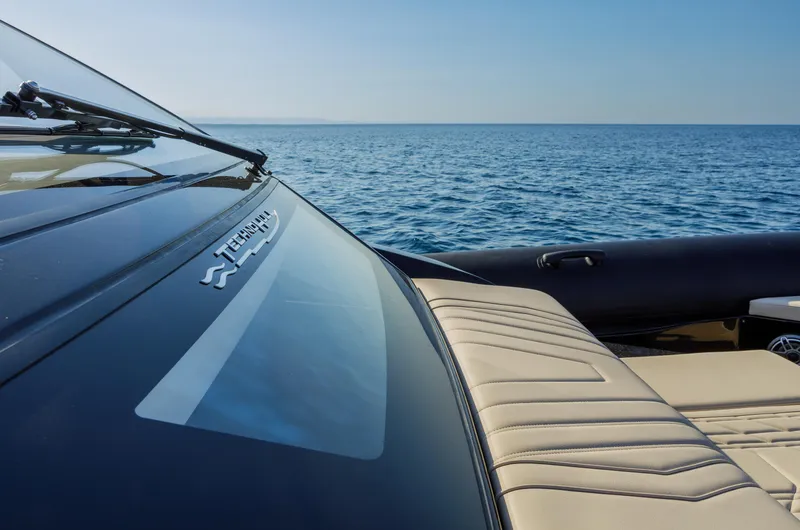 Slide: The Image of Technohull Alpha 40 yacht, 2025 model, cruising on open sea with sleek design. - 18