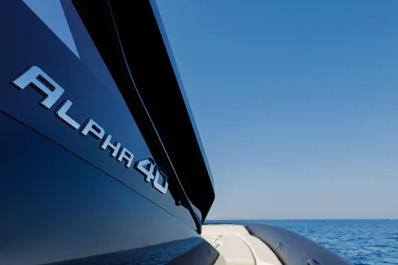 Slide: The Image of Technohull Alpha 40 yacht, 2025 model, cruising on a clear blue sea. - 19