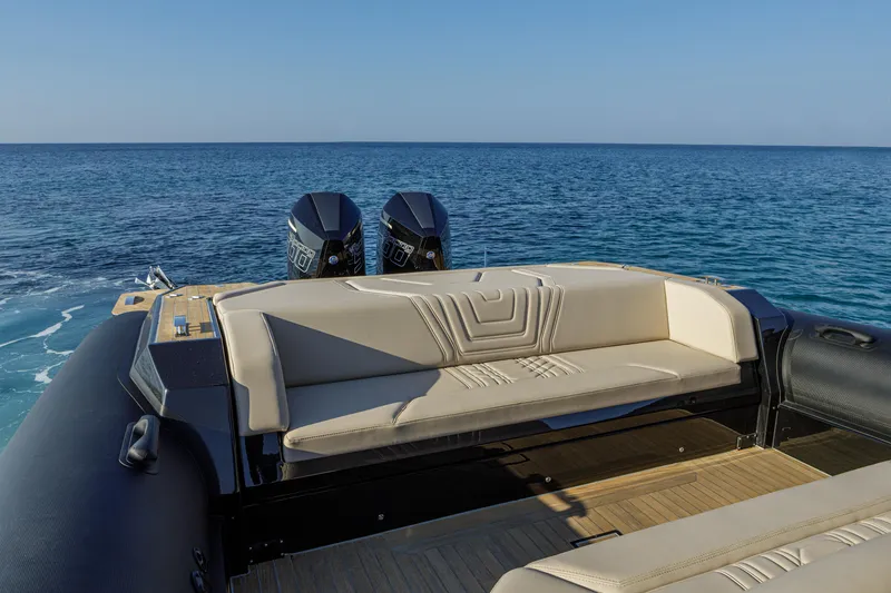 Slide: The Image of Technohull Alpha 40 (2025) luxury boat with twin engines, beige seating, and ocean view. - 20