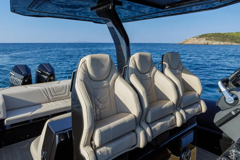 Slide: The Image of Luxurious seating on 2025 Technohull Alpha 40 boat, with ocean backdrop. - 23