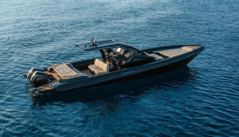 Slide: The Image of 2025 Technohull Alpha 40 luxury speedboat on calm blue water. - 3