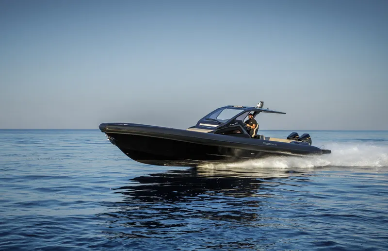 Slide: The Image of 2025 Technohull Alpha 40 speedboat cruising on calm ocean waters. - 6