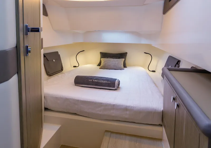 Slide: The Image of Luxurious cabin interior of 2025 Technohull Alpha 40 yacht, featuring a cozy bed and modern design. - 15