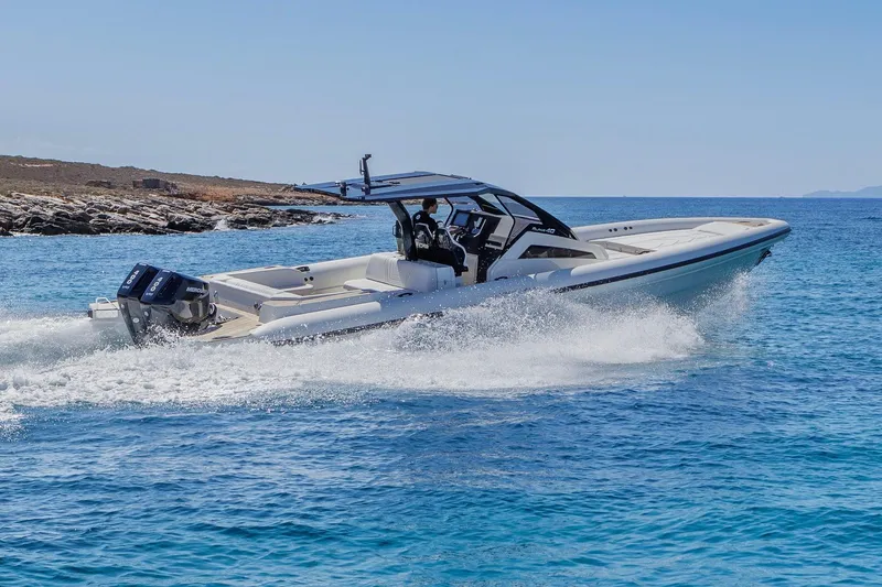 Slide: The Image of Technohull Alpha 40 (2025) speedboat cruising on clear blue water. - 5