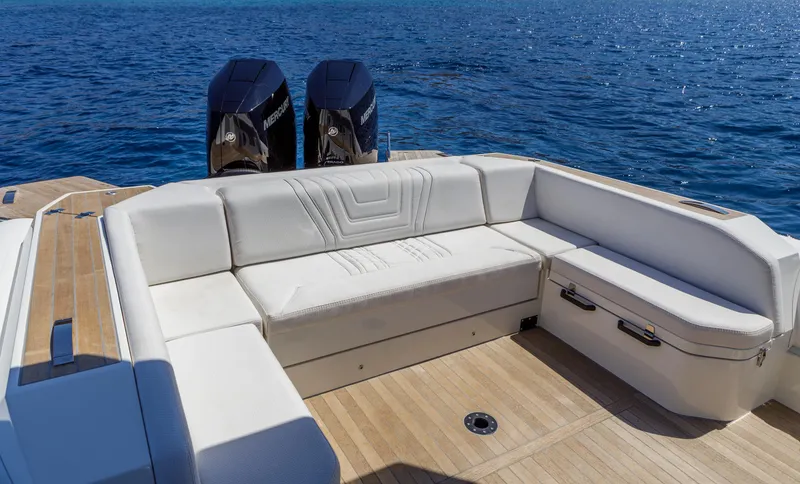 Slide: The Image of Luxurious Technohull Alpha 40 boat interior with white seating, 2025 model, on open water. - 6