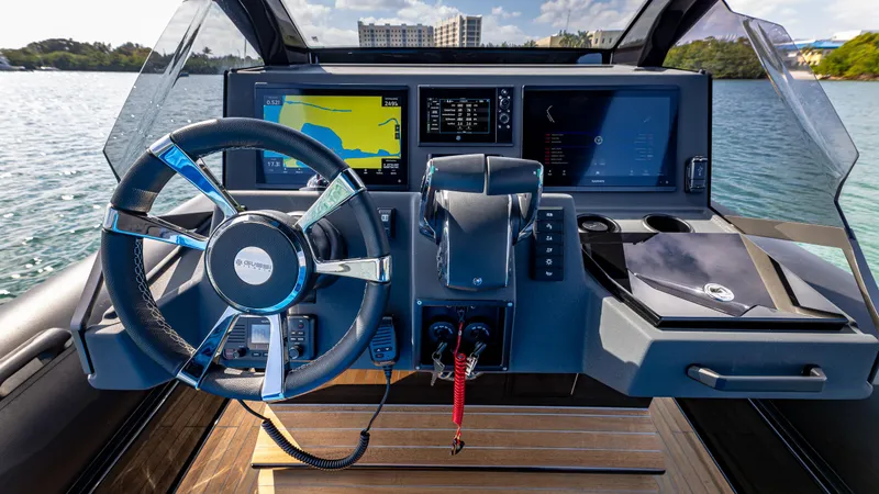 Slide: The Image of 2025 Technohull 38 Grand Sport dashboard with modern navigation and control systems on the water. - 25