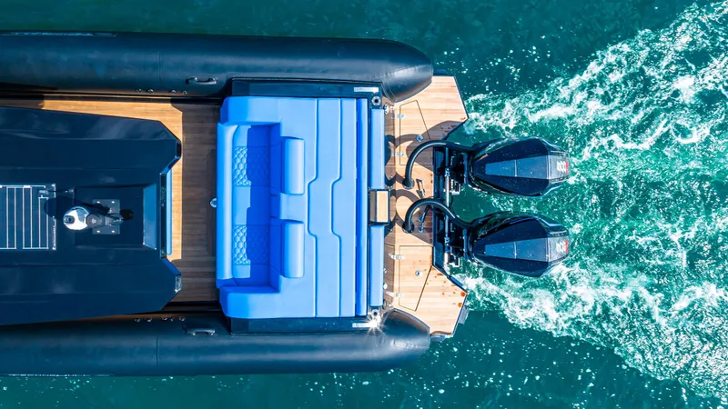 Slide: The Image of Aerial view of 2025 Technohull 38 Grand Sport boat with dual engines on water. - 8