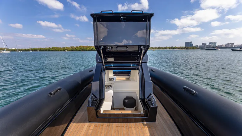 Slide: The Image of 2025 Technohull 38 Grand Sport yacht interior with open hatch, on calm water. - 25