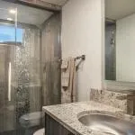Slide: The Image of Modern bathroom with glass shower and granite sink, Adonia Allure Trip 2020. - 5