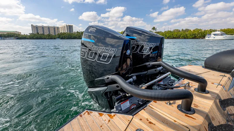 Slide: The Image of Technohull 38 Grand Sport 2025 with twin outboard engines on water. - 18