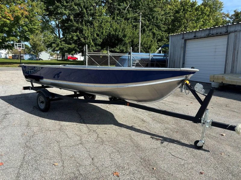 Slide: The Image of 2025 Crestliner 1672 Outlook boat on trailer in outdoor setting. - 3
