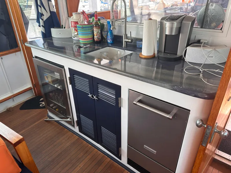 Slide: The Image of Aft wet bar with sink/fridge - 12