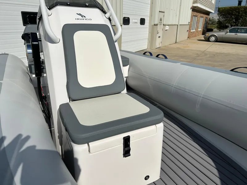 Slide: The Image of 2024 Highfield Classic 420 boat interior with cushioned seating and sleek design. - 10