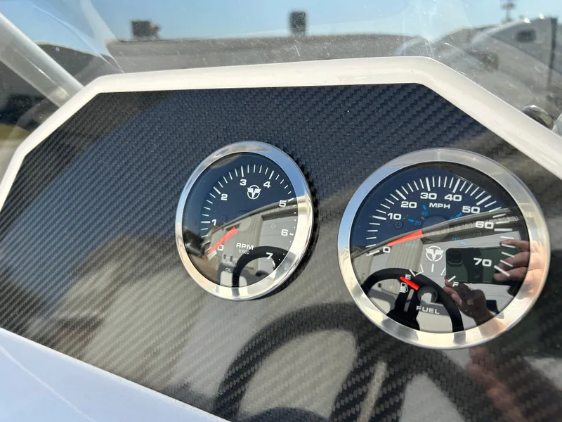 Slide: The Image of Dashboard of 2024 Highfield Classic 420 boat with speedometer and tachometer. - 11