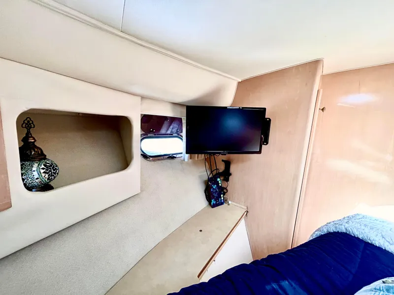 Slide: The Image of Interior of 1999 Carver Voyager 370 with TV and decorative lamp. - 21