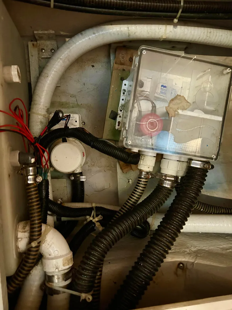Slide: The Image of Engine compartment of 1999 Carver Voyager 370 with wiring and hoses. - 29