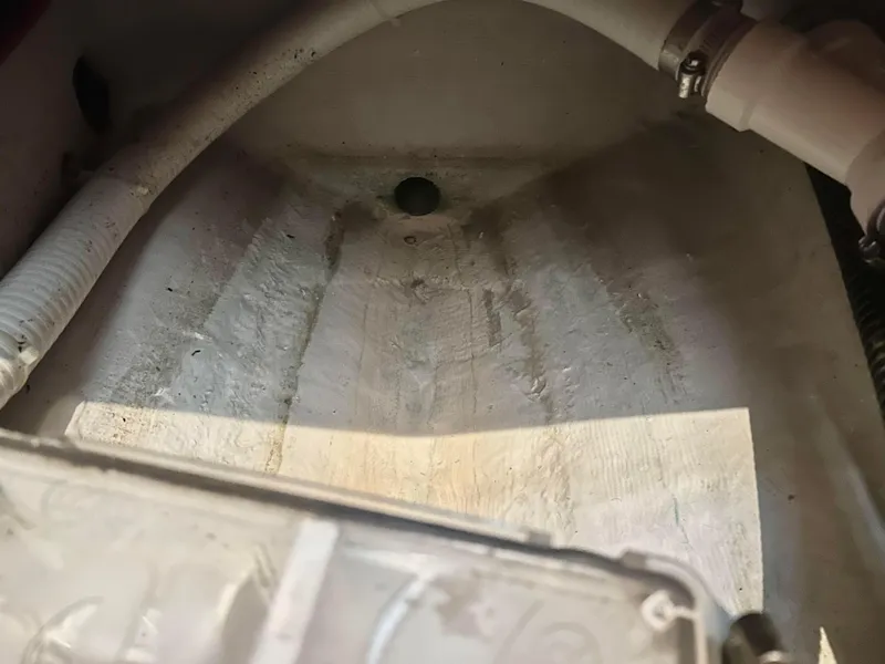 Slide: The Image of Interior view of a 1999 Carver Voyager 370 boat, showing plumbing and drainage components. - 31