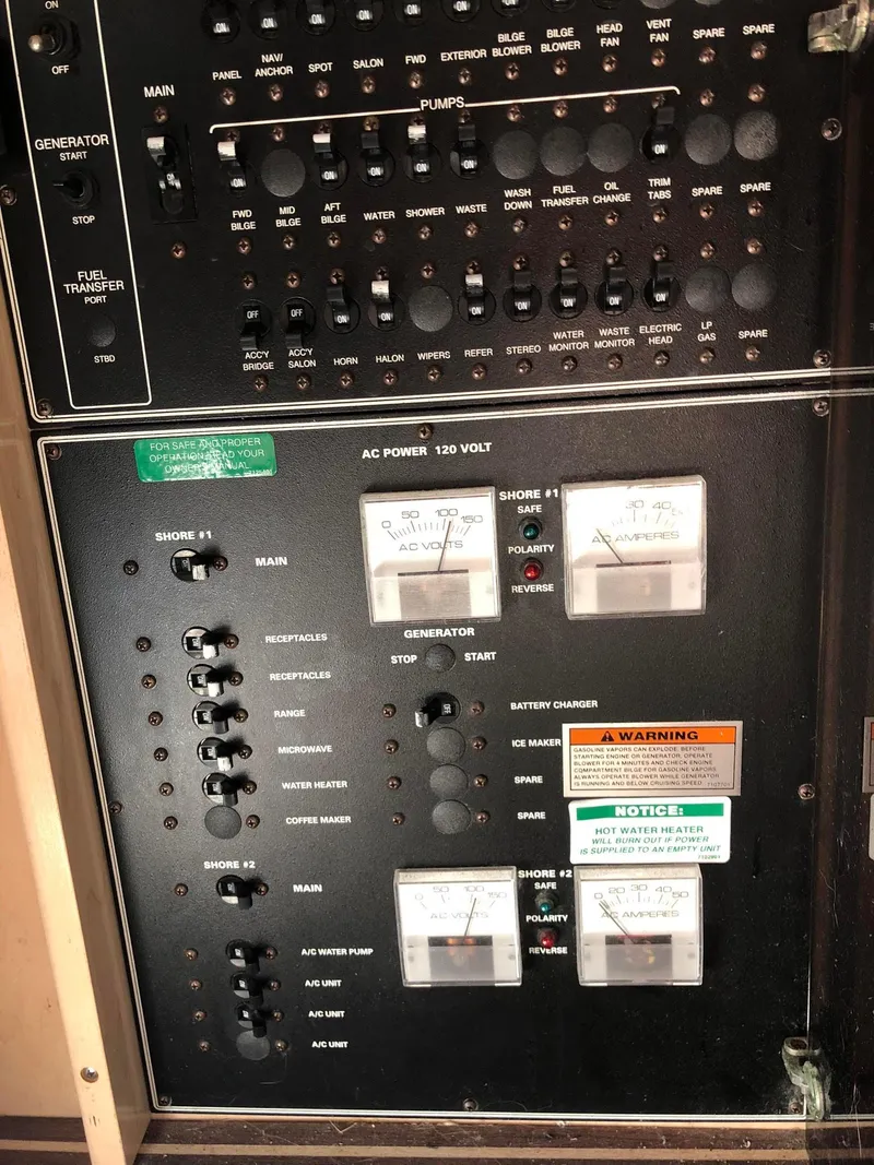 Slide: The Image of Control panel of a 1999 Carver Voyager 370 boat, featuring gauges and switches. - 33