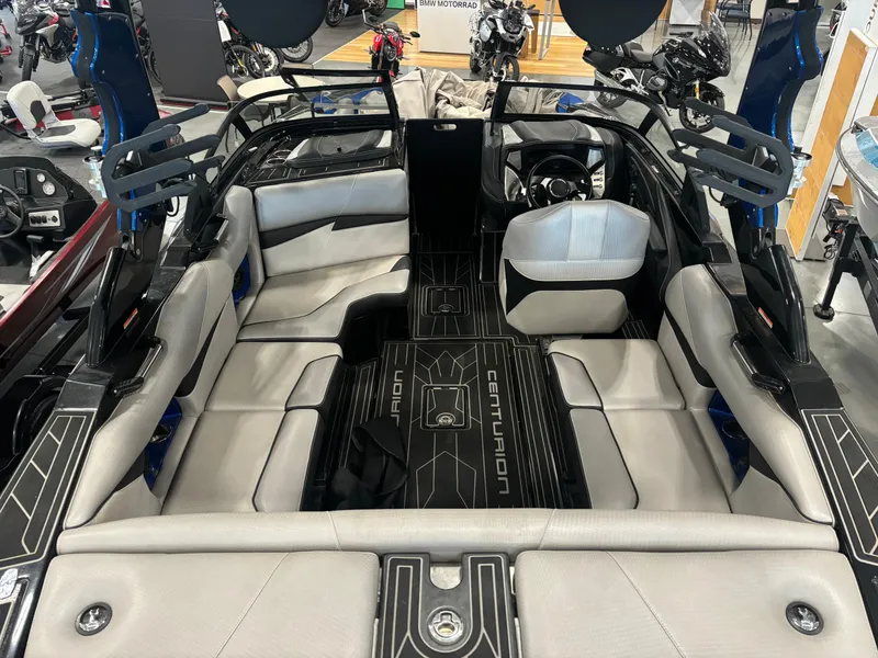 Slide: The Image of 2020 Centurion Fi21 boat interior with gray seating and sleek black flooring. - 4