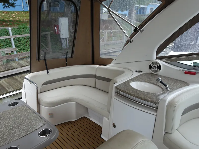 Slide: The Image of 2008 Chaparral Signature 330 interior with seating, table, and sink. - 10