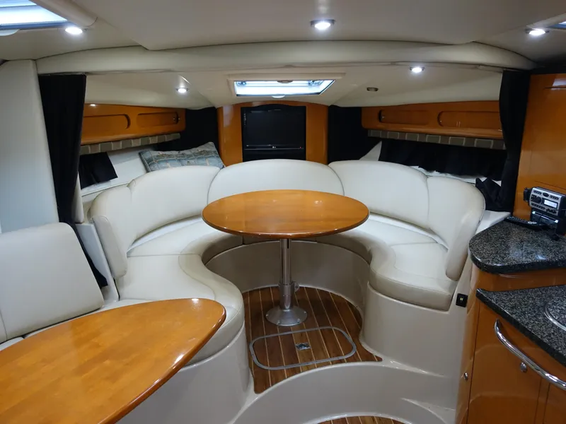 Slide: The Image of Luxurious interior of 2008 Chaparral Signature 330 yacht with elegant seating and wooden accents. - 12