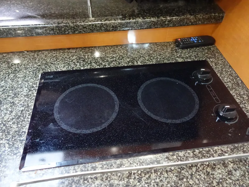 Slide: The Image of Granite countertop with electric cooktop in 2008 Chaparral Signature 330 yacht kitchen. - 15