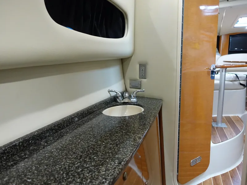 Slide: The Image of 2008 Chaparral Signature 330 interior with granite countertop and sink. - 19