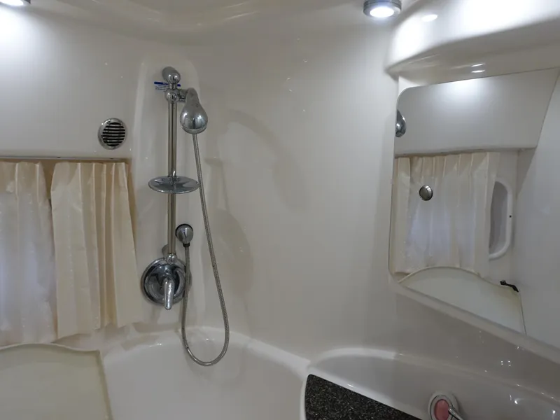 Slide: The Image of 2008 Chaparral Signature 330 bathroom with shower, mirror, and curtains. - 20