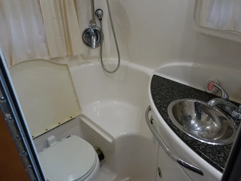 Slide: The Image of 2008 Chaparral Signature 330 bathroom with shower, sink, and toilet. - 21