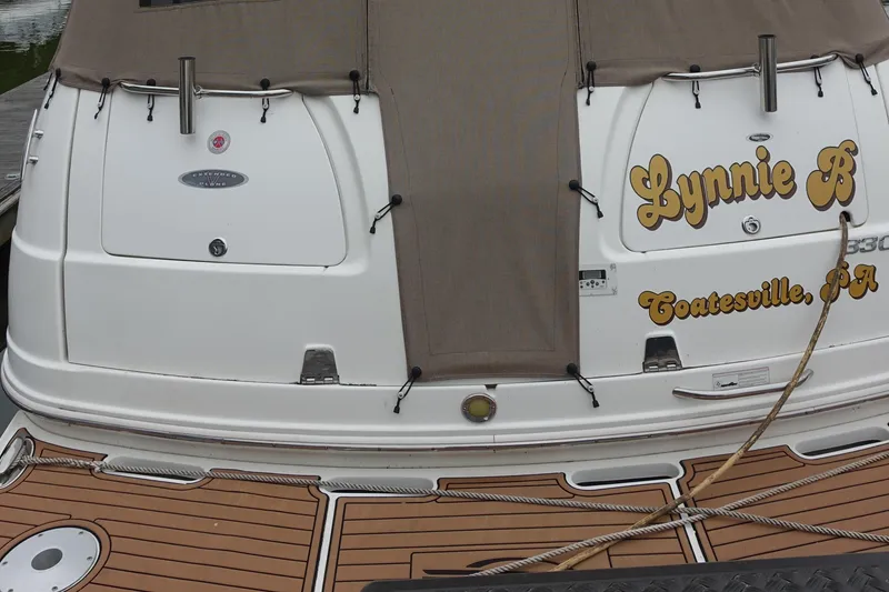 Slide: The Image of 2008 Chaparral Signature 330 boat stern with custom name and wood deck. - 25