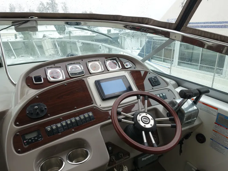 Slide: The Image of 2008 Chaparral Signature 330 boat dashboard with steering wheel and navigation controls. - 3