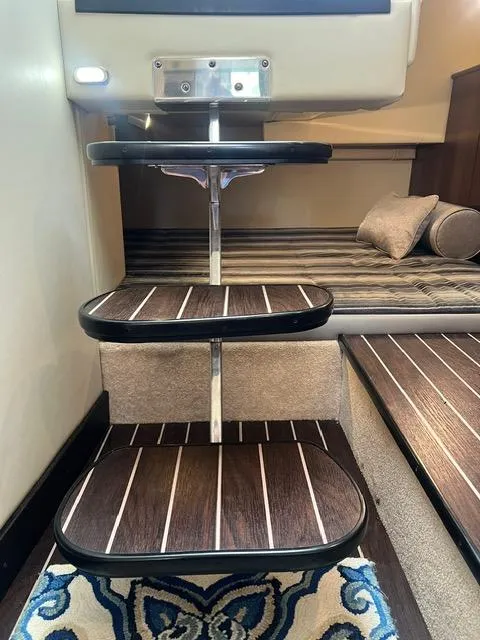Slide: The Image of Interior stairs of 2017 Monterey 295 Sport Yacht with wood finish and cozy cabin. - 19