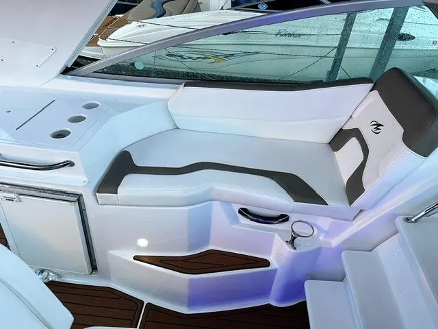 Slide: The Image of 2017 Monterey 295 Sport Yacht interior with white seating and modern design. - 20