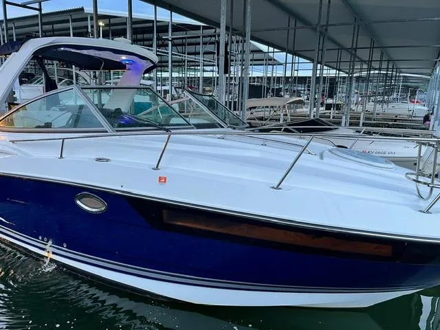 Slide: The Image of 2017 Monterey 295 Sport Yacht docked in a marina, showcasing sleek design and modern features. - 3