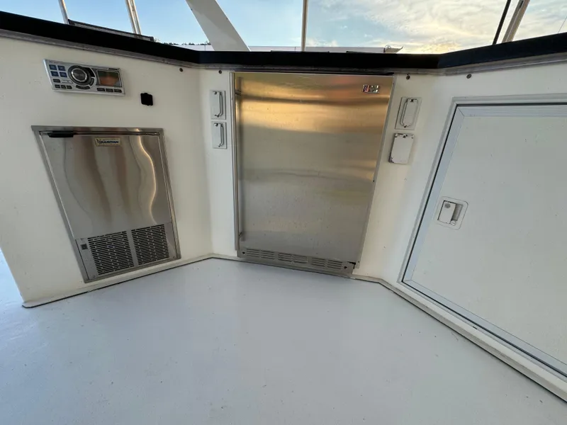 Slide: The Image of 2004 Sumerset 20x100 houseboat kitchen area with stainless steel appliances. - 10