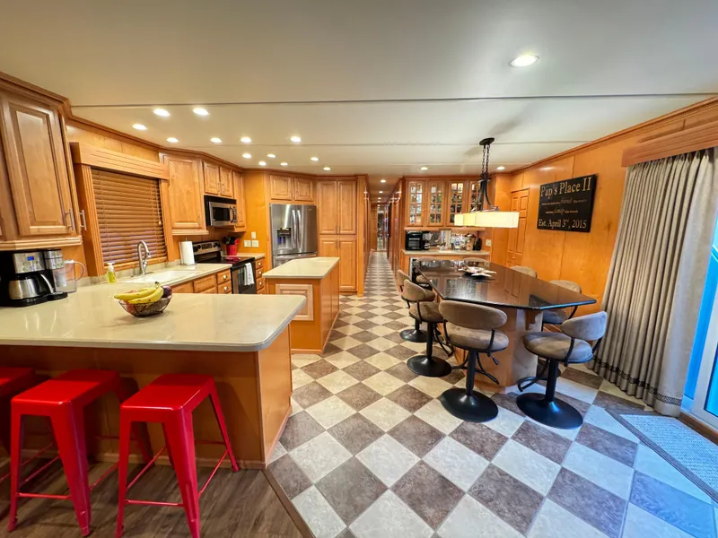 Slide: The Image of Spacious kitchen in 2004 Sumerset 20x100 houseboat with modern amenities and stylish decor. - 18