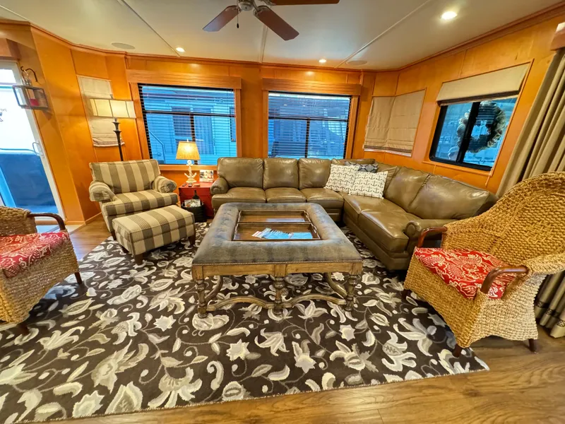 Slide: The Image of Cozy living area in 2004 Sumerset 20x100 houseboat with stylish furniture and decor. - 19