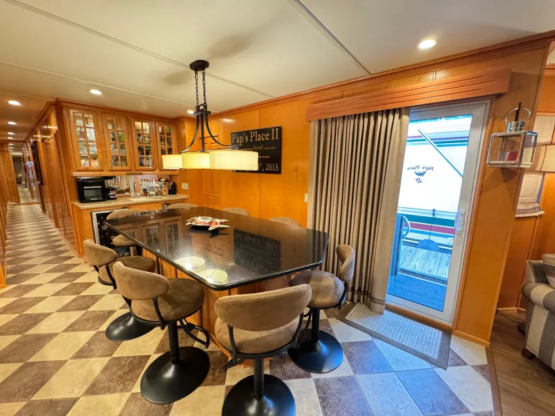 Slide: The Image of Luxurious 2004 Sumerset 20x100 houseboat interior with elegant dining area and modern kitchen. - 22