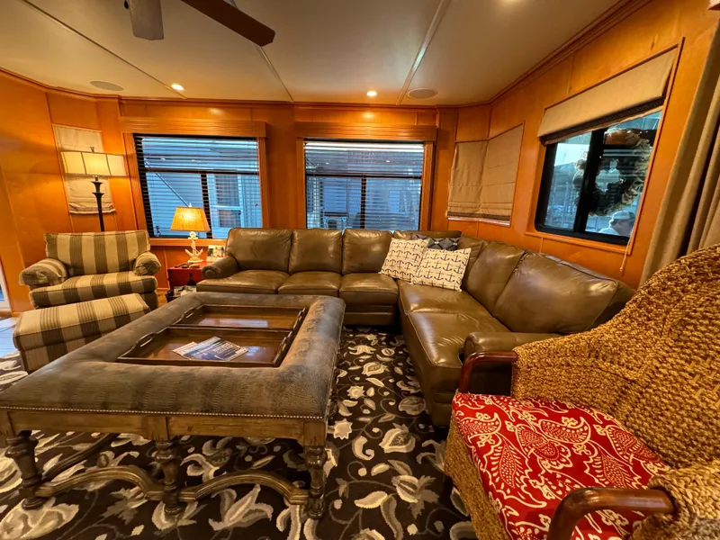 Slide: The Image of Luxurious 2004 Sumerset 20x100 houseboat interior with cozy seating and elegant decor. - 24
