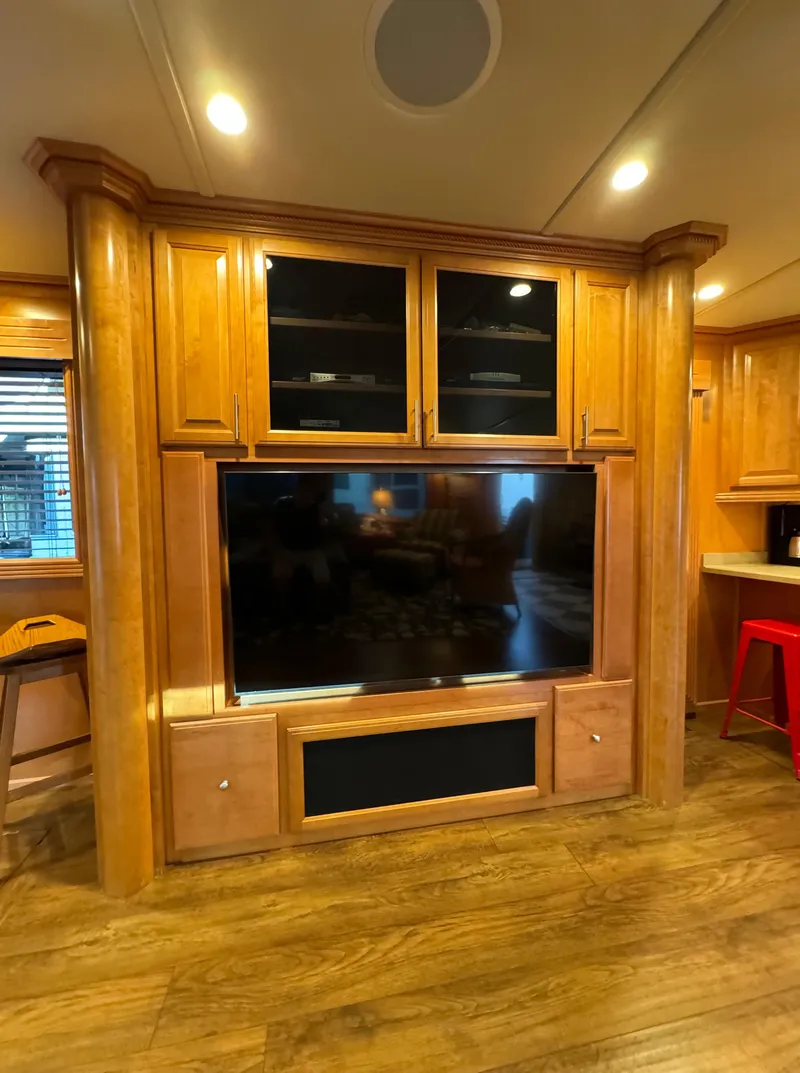 Slide: The Image of Luxurious Sumerset 20x100 houseboat interior with wooden entertainment center, 2004 model. - 28