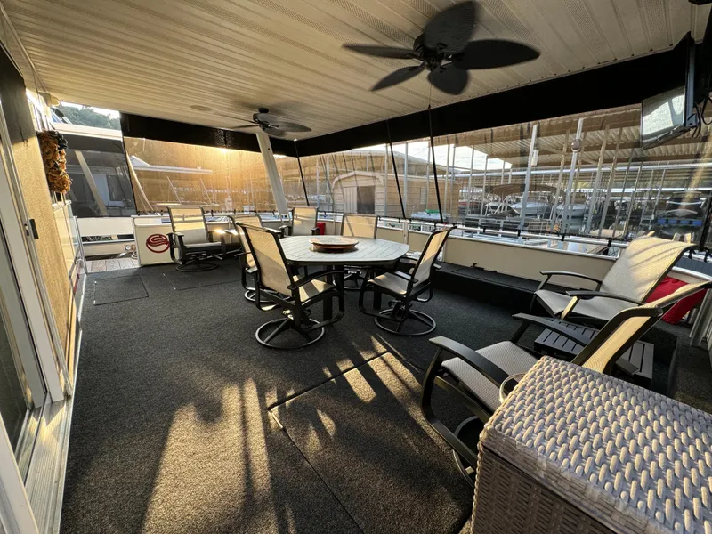 Slide: The Image of Spacious 2004 Sumerset 20x100 houseboat deck with seating and ceiling fans. - 3