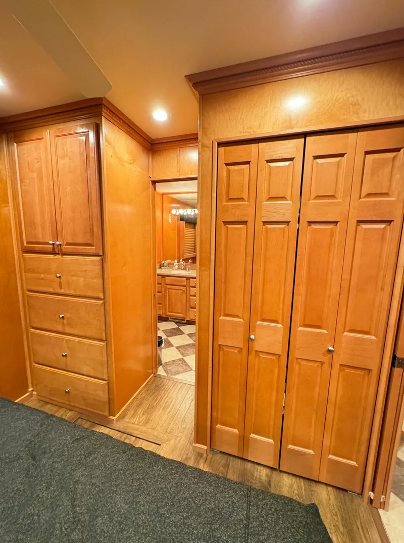 Slide: The Image of Luxurious wood interior of 2004 Sumerset 20x100 houseboat with ample storage. - 32