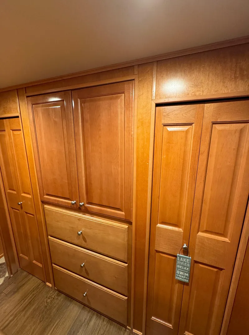 Slide: The Image of Wooden cabinetry in a 2004 Sumerset 20x100 houseboat interior. - 37